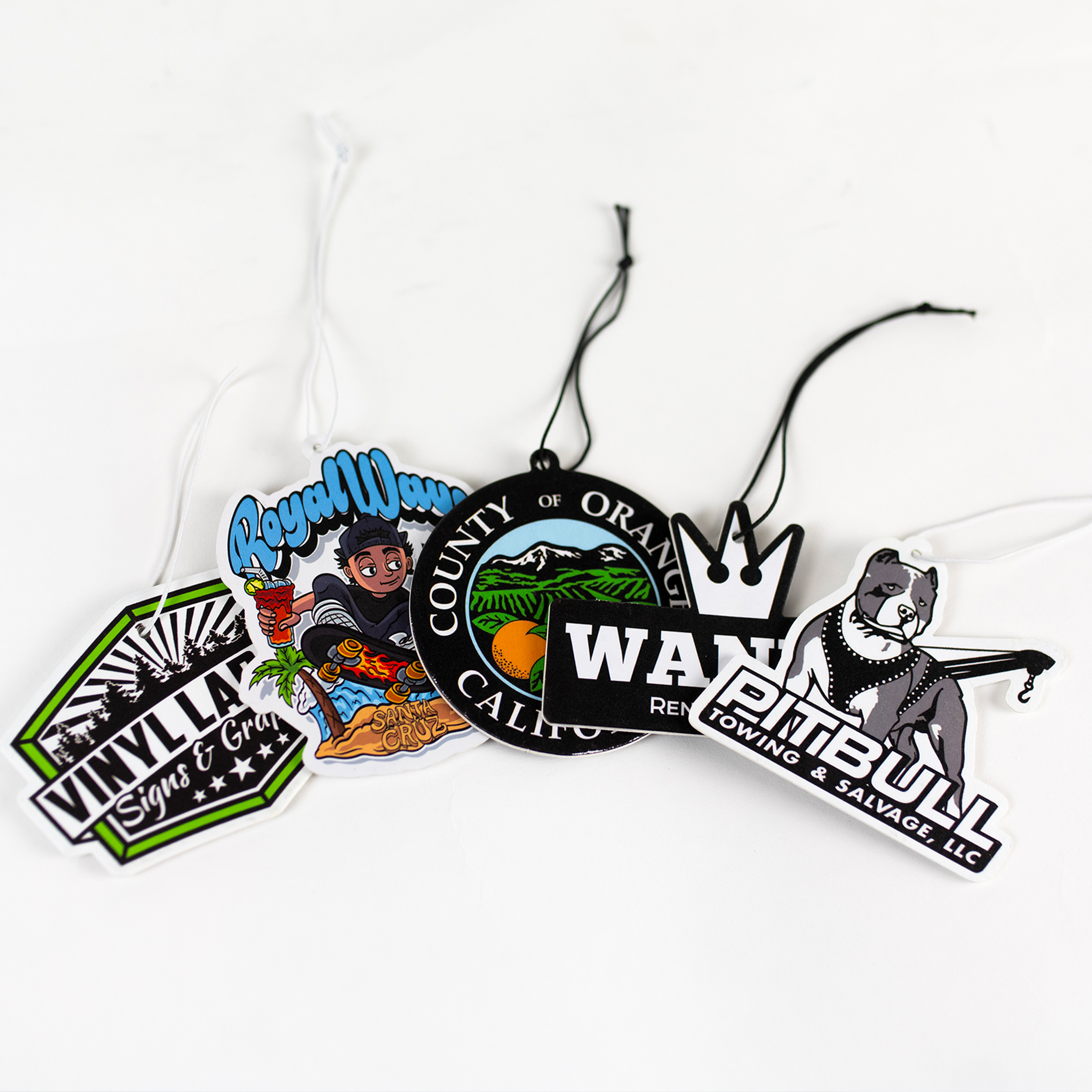 Assortment of Custom air fresheners that are diecut to customers logo