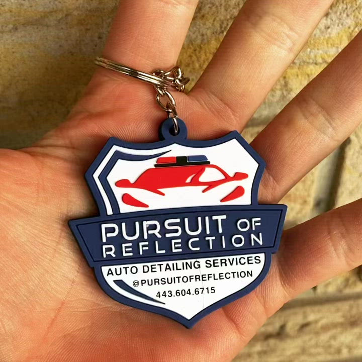 upclose of rubber keychain of customers logo raised