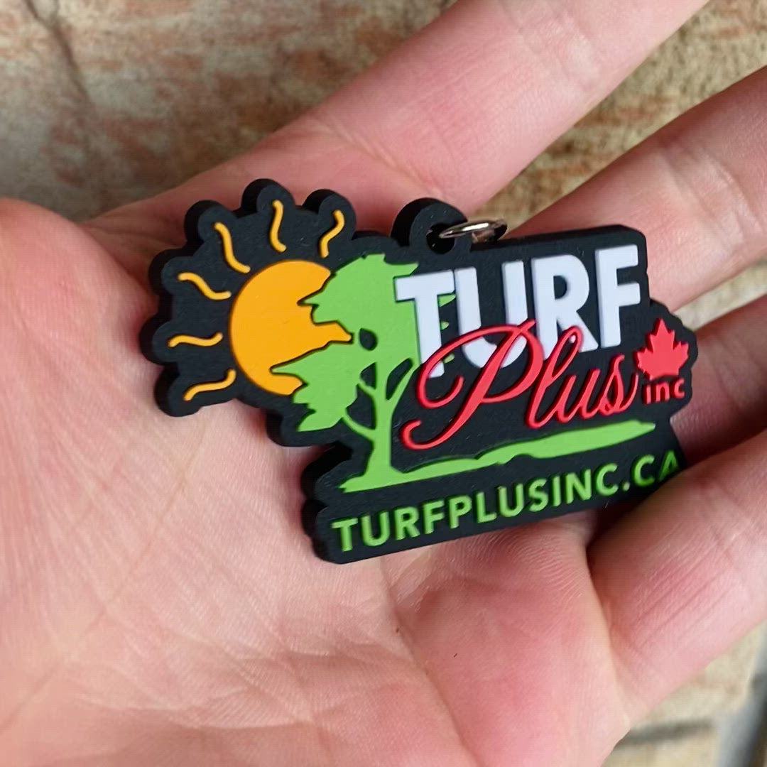 upclose of rubber diecut keychains company logo business promotional showing the 3d raised elements