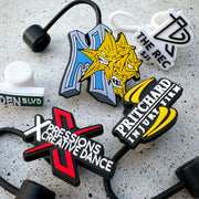 Assorted Bulk custom rubber straw toppers featuring multiple business logos, including Xpressions Creative Dance, Pritchard Injury Firm, and The Rec SJC, made from durable 3D rubber  PVC material for promotional branding.